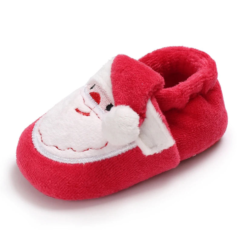 Red baby bootie with a white face on a white background