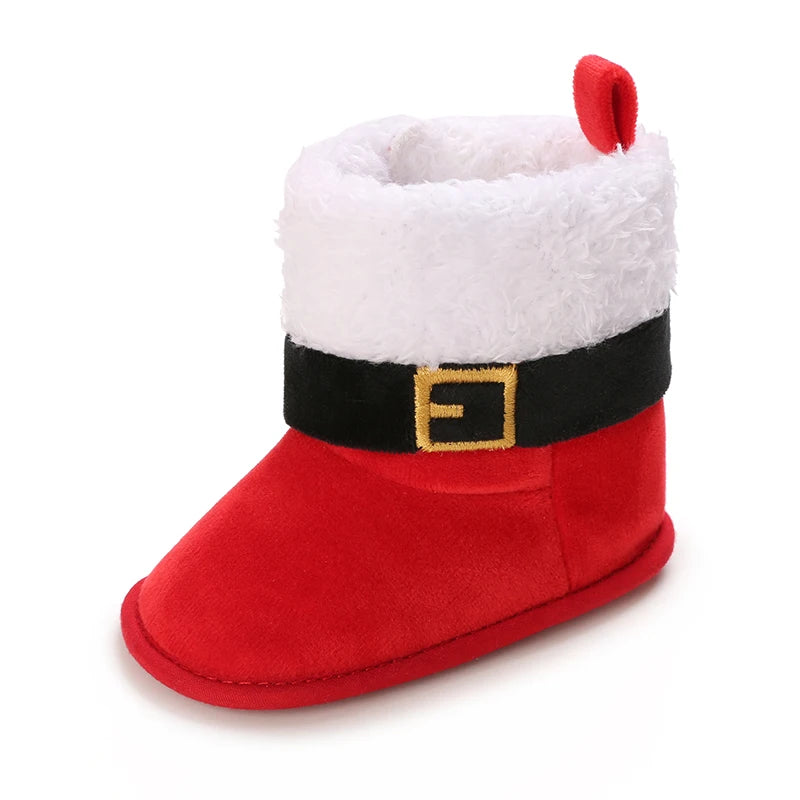 Red baby bootie with white fur lining and black belt on a white background