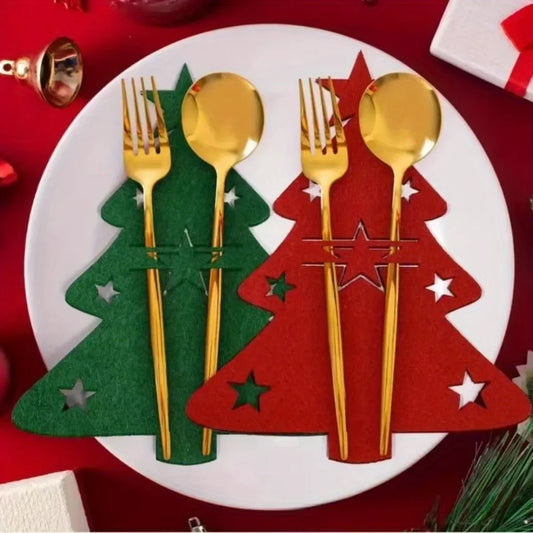 Gold cutlery set on Christmas-themed place mats with a red background