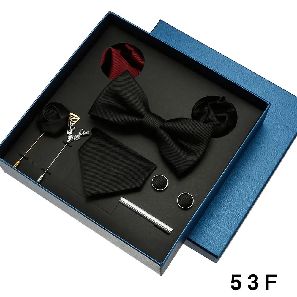 Black bow tie set with accessories in a blue box