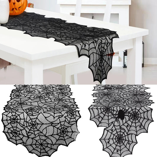 Black lace spiderweb table runner on a white table with additional designs displayed below.