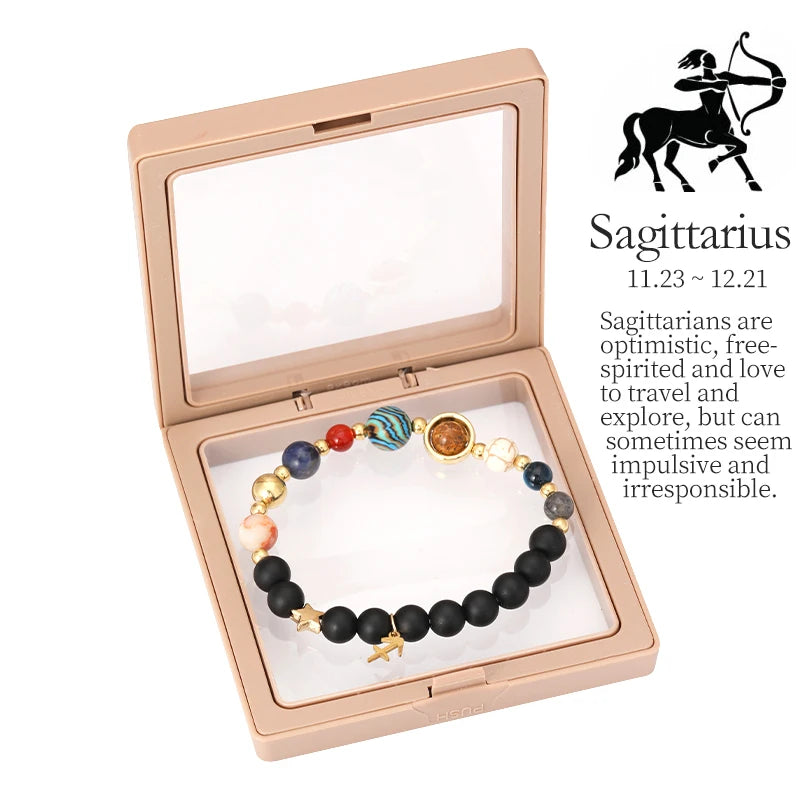 Bracelet in a box with Sagittarius zodiac information on a white background
