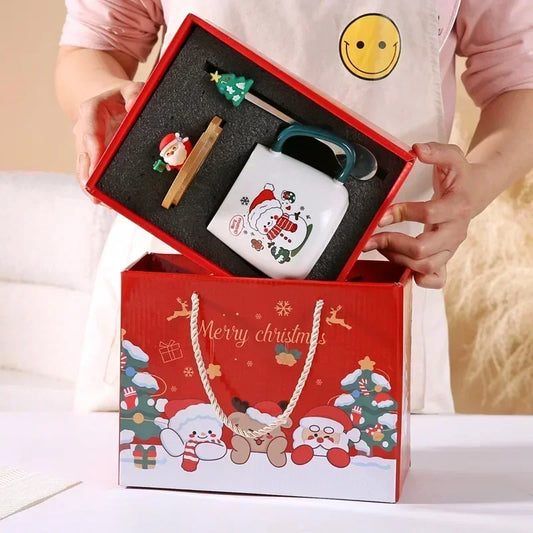 Christmas-themed gift set with a mug, lid and spoon in a red box.