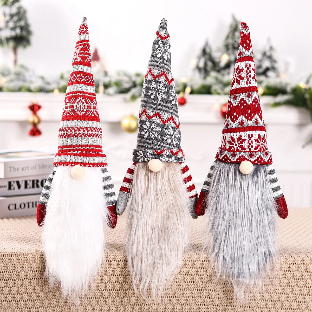 Three Christmas-themed gnomes covering wine bottles with knitted hats on a neutral background