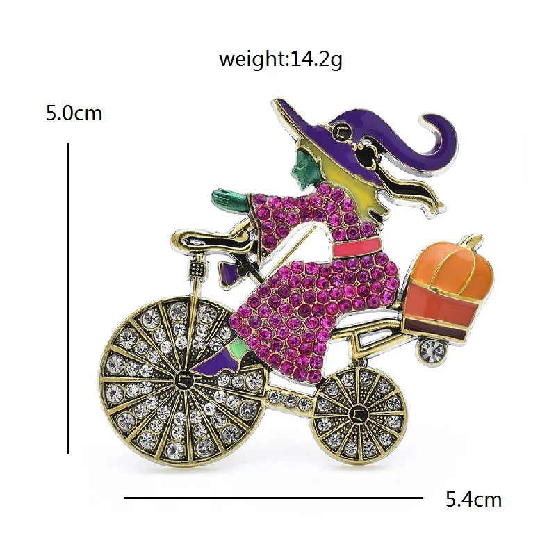 Colorful brooch of a person riding a bicycle with measurements and weight displayed.