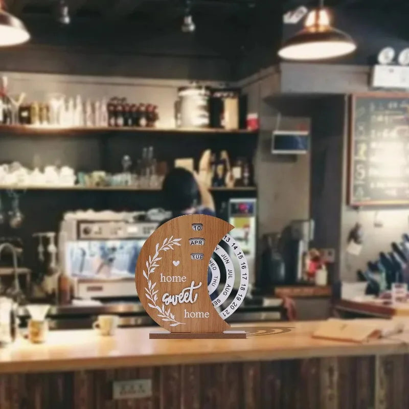 Decorative calendar with 'home sweet home' text on a bar counter.