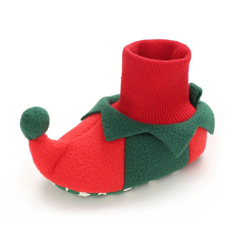 Red and green baby bootie on a white background