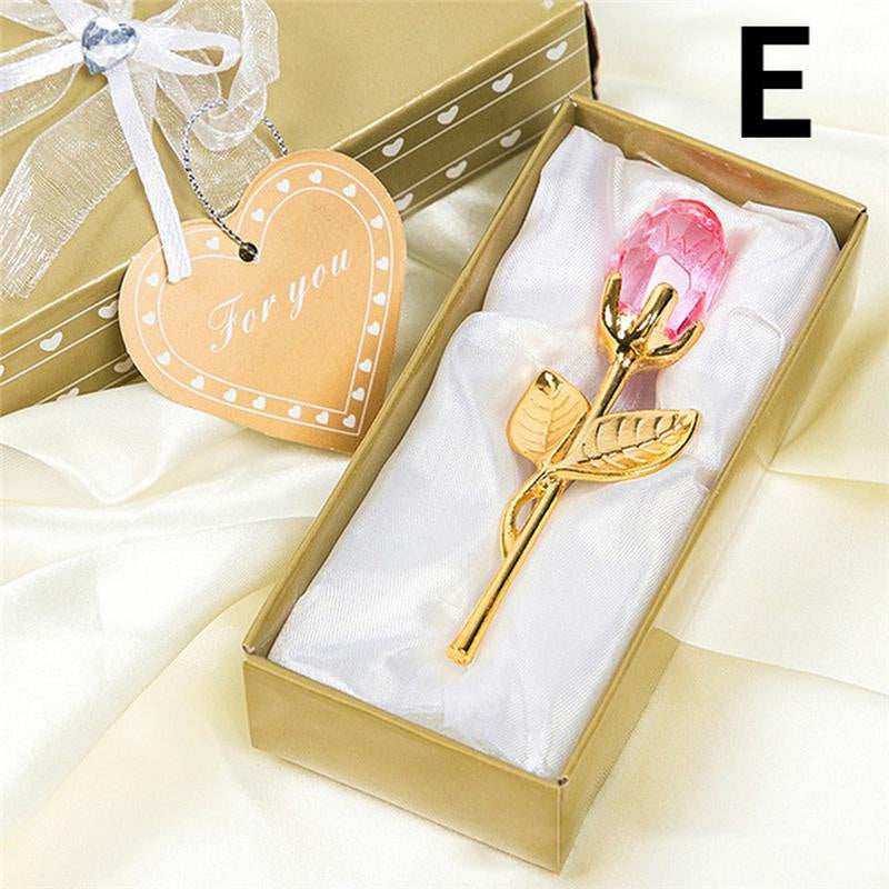 Gold rose with pink gem in a decorative box, accompanied by a heart-shaped 'For you' tag.