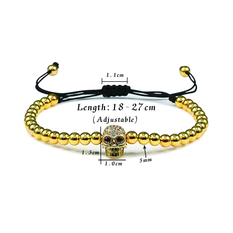 Gold beaded bracelet with a skull charm, showing measurements