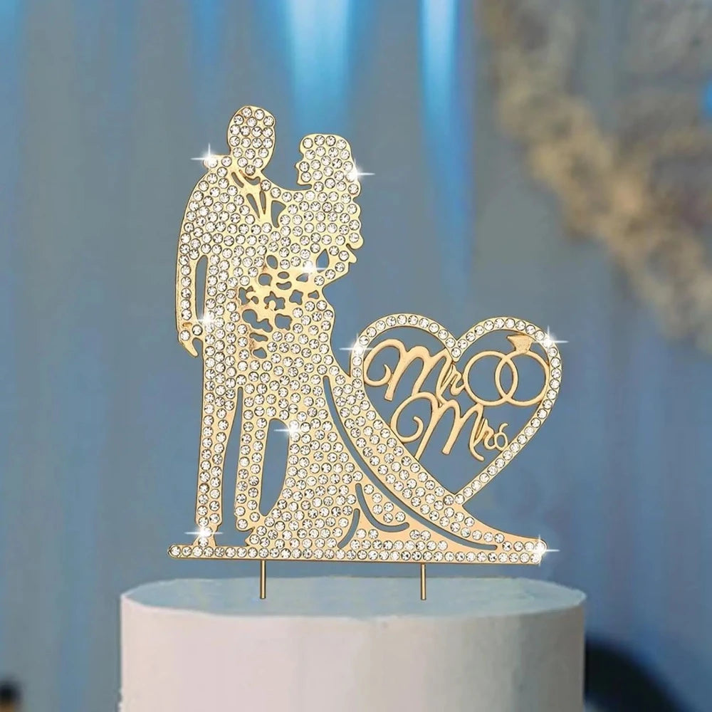 Gold cake topper with 'Mr & Mrs' design on a white cake 