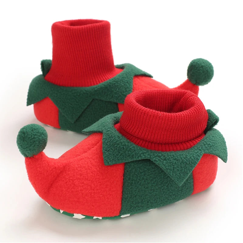Red and green Elf baby booties with a white background