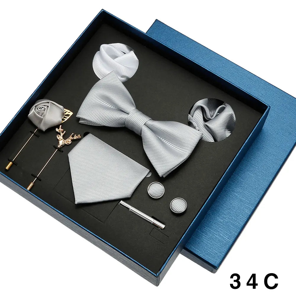 Gray bow tie and accessories set in a blue box