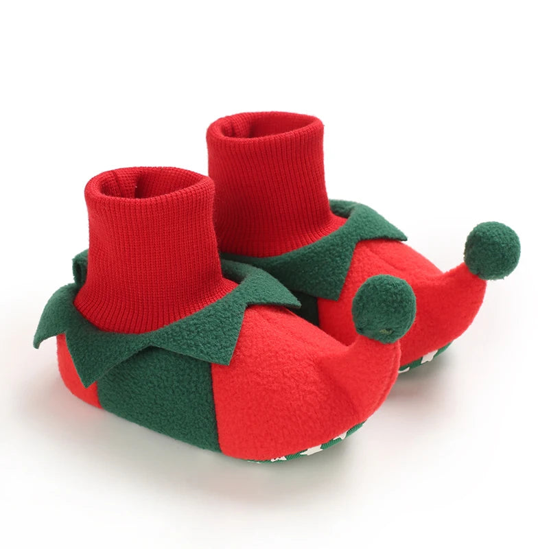 Red and green baby booties on a white background