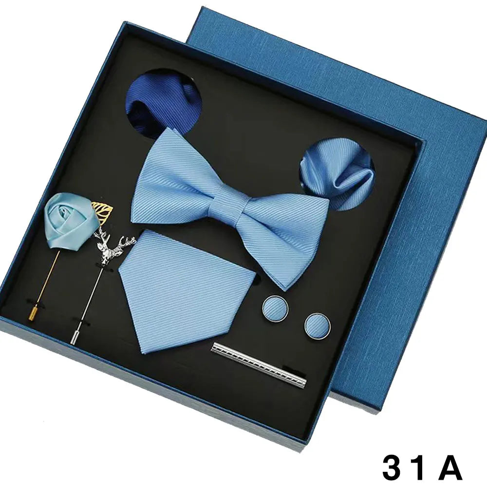 Blue bow tie set with accessories in a box