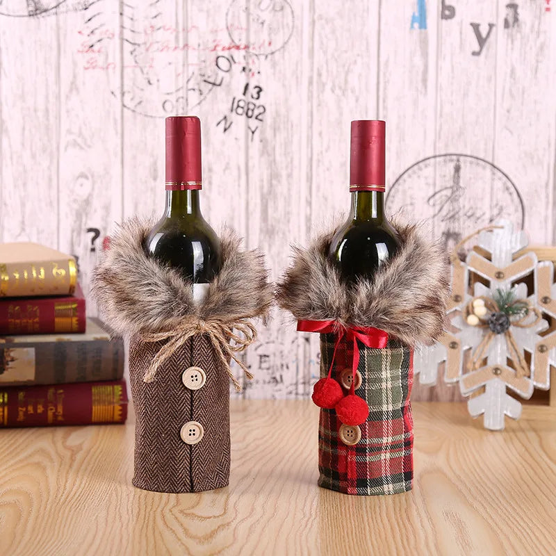 Two wine bottles wrapped in decorative covers with fur accents on a wooden surface.