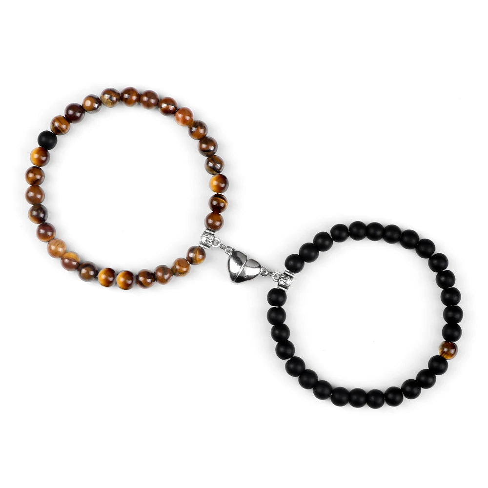Black and brown beaded bracelets on a white background