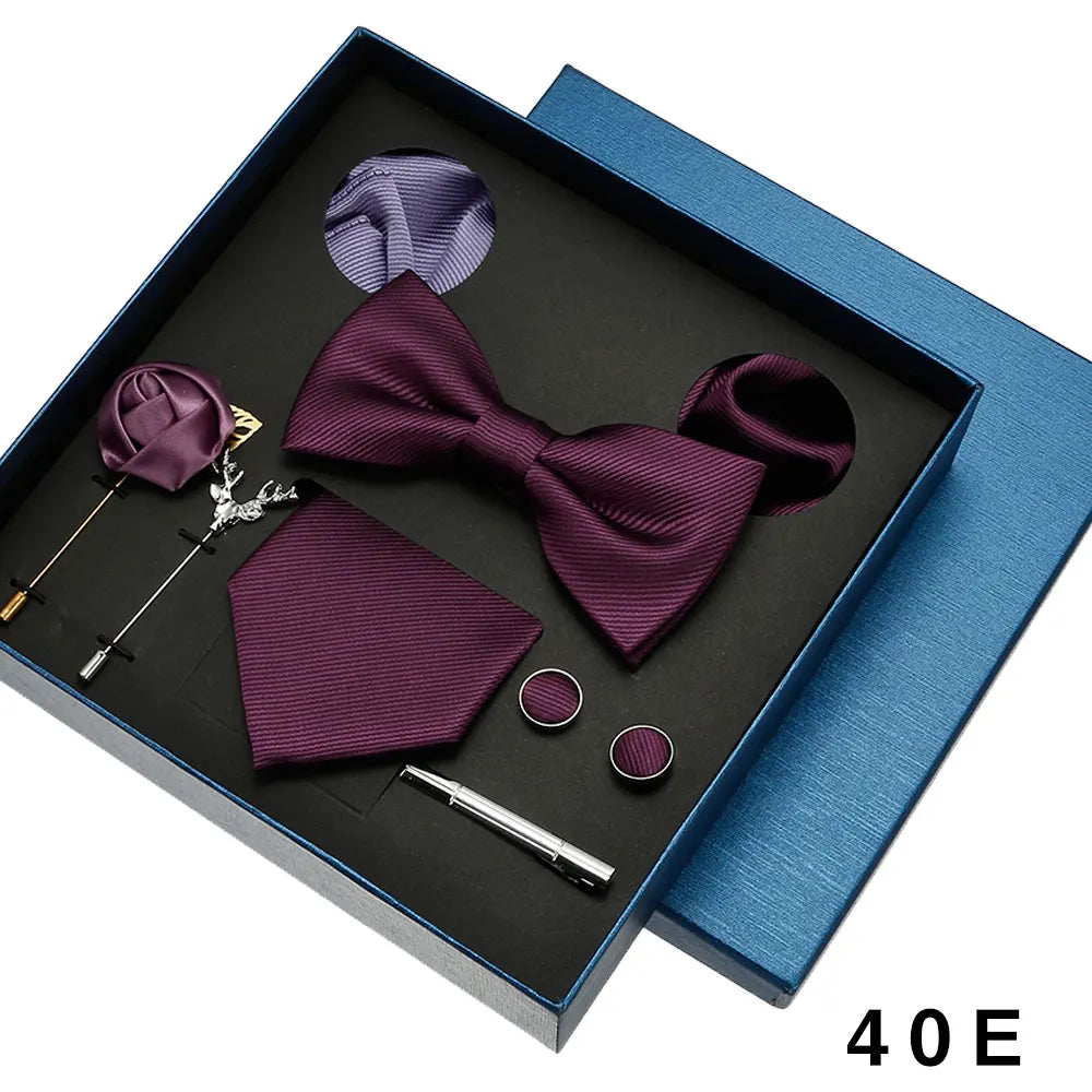 Purple bow tie set with accessories in a blue box