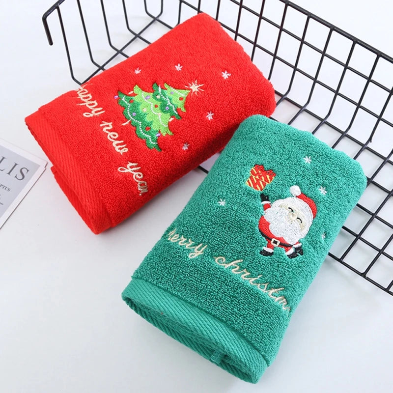 Red and green Christmas-themed towels on a wire rack.