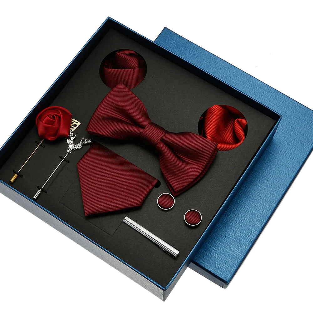 Red bow tie and pocket square set with accessories in a blue box