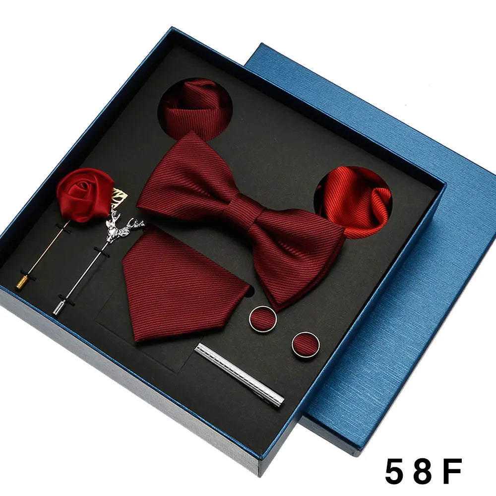 Red bow tie set with accessories in a blue box