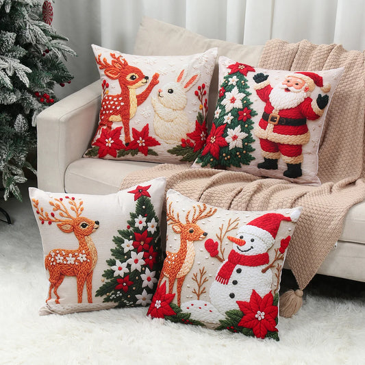 Set of Christmas-themed decorative pillows on a couch with a decorated tree in the background.