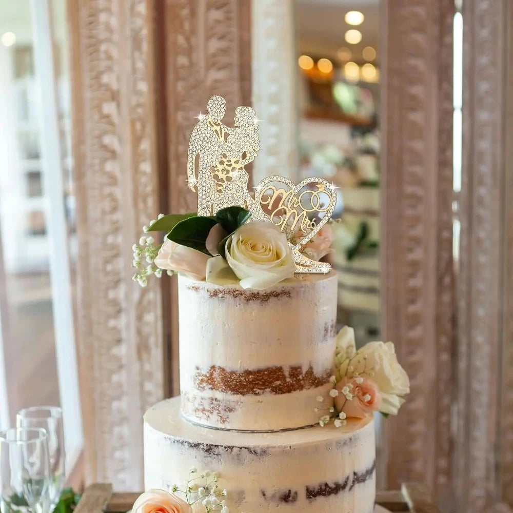 Wedding cake with decorative topper and flowers in a blurred indoor setting