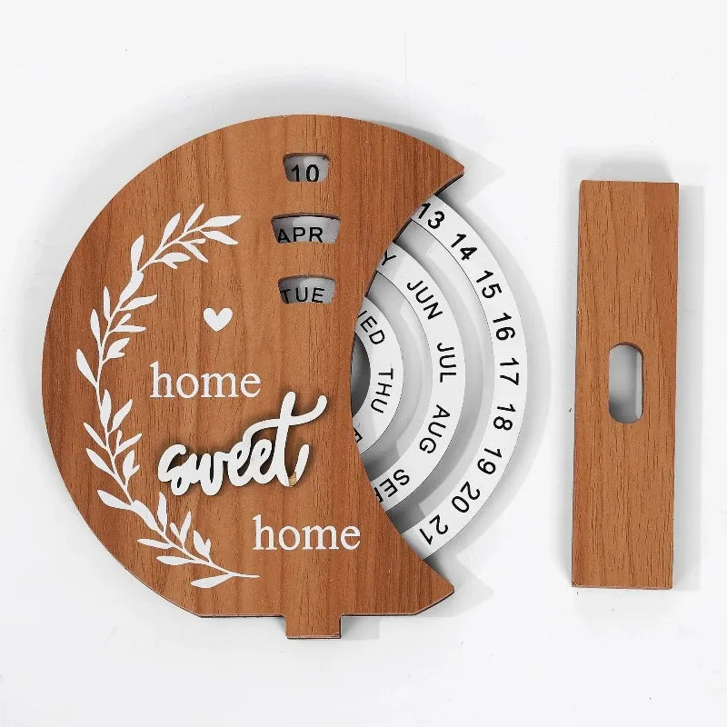 Wooden round calendar with 'home sweet home' on a white background